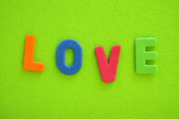 Love, love you lettering by colorful letters, textured background	