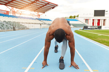 ready, steady , go. sportsman waiting for signal to run, full length photo. healthy lifestyle
