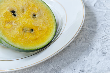 slices of yellow watermelon on a plate