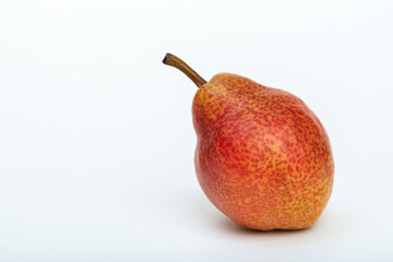 Ripe red pear on white background