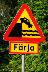 Ferry berth and quayside road warning sign with the word for ferry in the Swedish language.