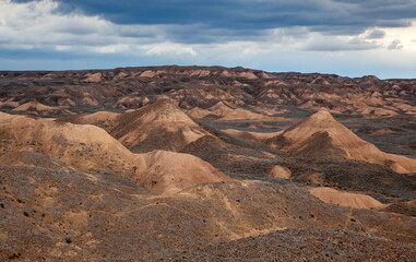 Clay-chalk hills of Kazakhstan with sparse vegetation.