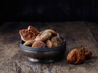 dried figs on rustic wooden table