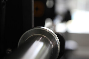 A closeup shot of a barbell at a fitness center
