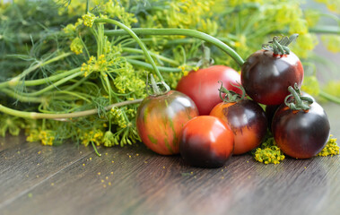 Fresh tomatoes on wooden background.