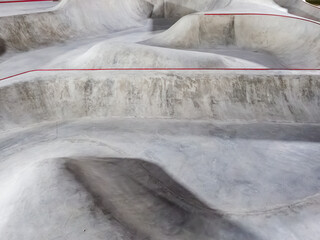Concrete skate park with bowls and ramps. Full screen photo © jockermax3d