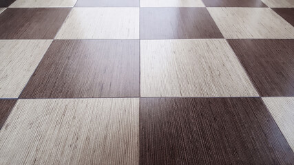 Brown and beige tiles floor. Repair in the house, bathroom, kitchen