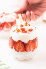 Breakfast of Greek Yogurt Glass with chia and strawberries.