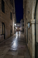 Fototapeta na wymiar Old City of Dubrovnik. Narrow street of medieval town at night, Dalmatia Croatia