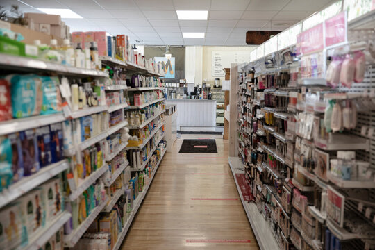 Drugstore aisle with social distancing markers