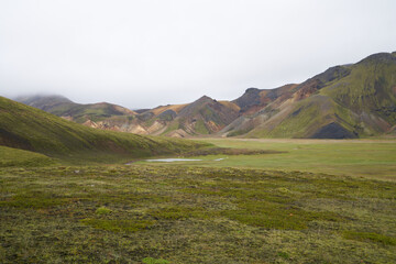 Beautiful Landmanalaugar gravel dust road way on highland of Iceland, Europe. Muddy tough terrain for extreme 4WD 4x4 vehicle. Landmanalaugar landscape is famous for nature trekking and hiking.