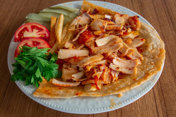 fried chicken with tomato and parsley