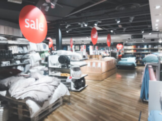 Blurry conceptual background Concept. Clothing and accessories for bedroom, Shop using labels write "sale" to mean discount during festival or holiday of store. There is a stand in front of the store.