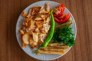fried chicken with tomato and parsley