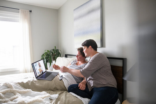 Sick Lesbian Couple With Medication Video Chatting With Doctor