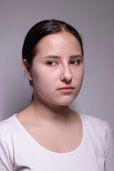 Fototapeta premium portrait of sad and depressed young woman. on gray background. nervous and upset people concept.