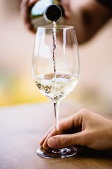 White wine splashing into a glass.ARW