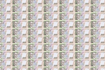 500 Ukrainian hryvnias bills printed in money production conveyor. Collage of many bills. Concept...
