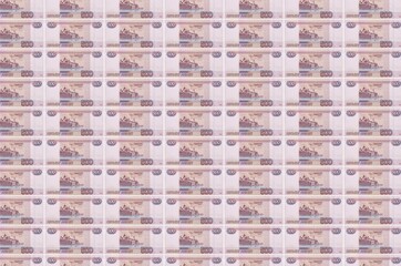 500 russian rubles bills printed in money production conveyor. Collage of many bills. Concept of...