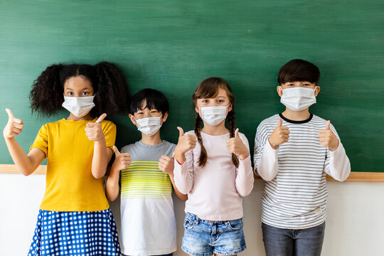 Diversity Of Children Students Wearing Medical Masks In The Classroom