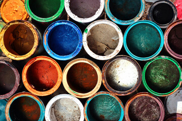 Old dirty metal paint cans as background