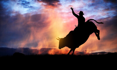 Fototapeta na wymiar bull rider silhouette at sunset