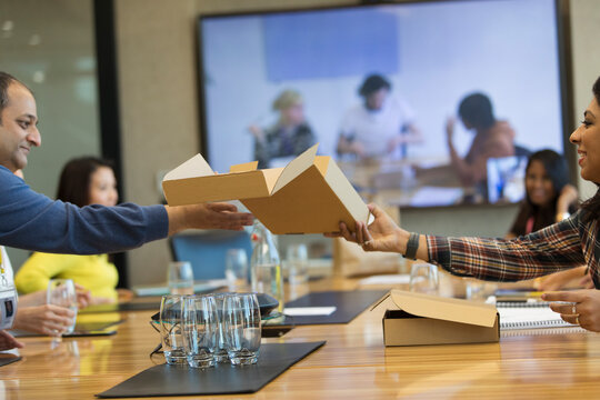 Business people sharing lunch in conference room meeting