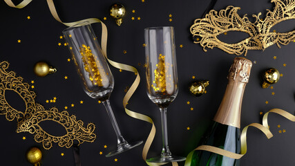 Sparkle golden Christmas decorations, masquerade masks, champagne bottle with wine glasses, party...