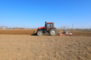 Planter planting peas on farm, North China