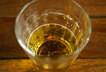 Glass of beer on table