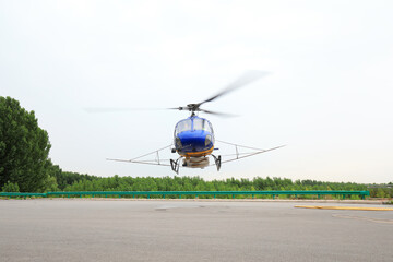 Agricultural helicopters fly in the sky