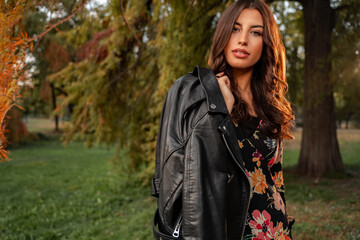 Amazing curly hair brunette with leather jacket , fall fashion girl 
