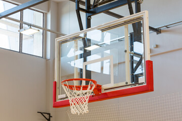 Basketball backboard and hoop in sport hall © rilueda