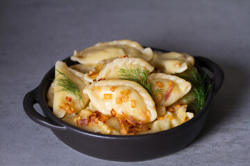 Dumplings, filled with potato. Varenyky, vareniki, pierogi, pyrohy - dumplings with filling
