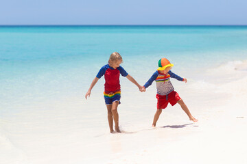 Kids playing on beach. Children play at sea.