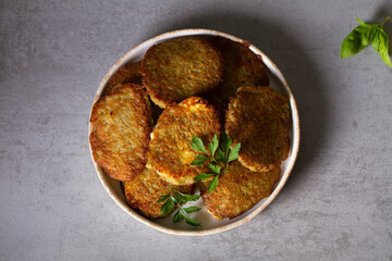 Potato cakes. Vegetable fritters, pancakes, latkes, draniki - popular dish in many countries. View from above, top studio shot