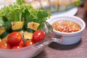 Colorful and healthy salad roll with fresh tomato