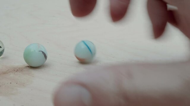 hitting marbles together