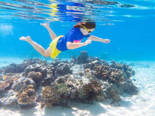 Child snorkeling. Kids underwater. Beach and sea.