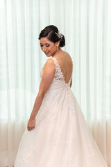 Latino Bride elegant open back sleeveless wedding dress  posing portrait