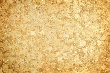 Gold leaf attached to the wall texture background