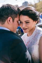 Latino Bride and groom close up feeling the moment