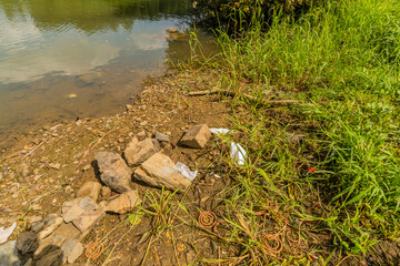 Medical face mask laying on ground