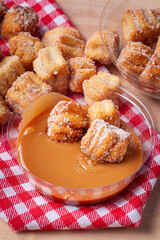.Homemade mini churros with dulce de leche