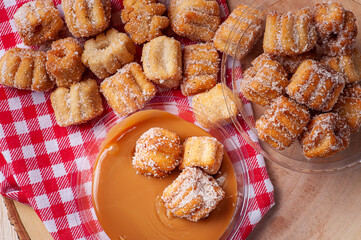 .Homemade mini churros with dulce de leche