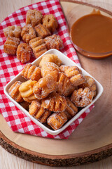 .Homemade mini churros with dulce de leche