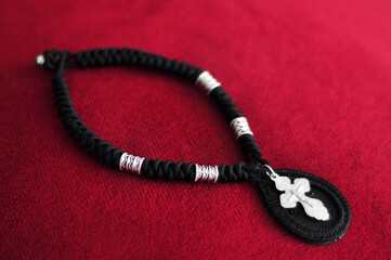 Wicker pendant amulet with metal beads and silver Orthodox cross