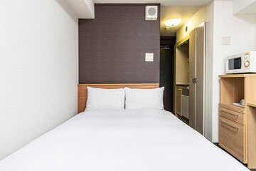 Single bed in modern small bedroom at apartment