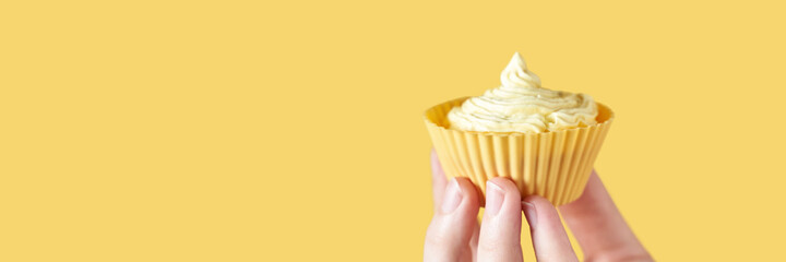 Yellow monochrome bakery. Sustainable cupcake cup. Hold in hand. Gold maffin cream. Trendy colourful desert. Bright birthday gift. Horizontal banner with copyspace