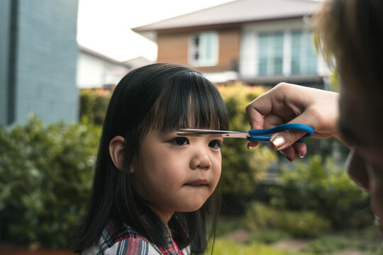 Mom Was Cutting Her Hair For Her Daughter At Home.